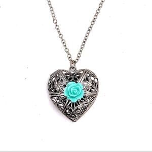 Necklace with heart pendant on chain with turquoise rose